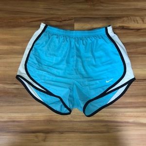 Blue Nike running shorts